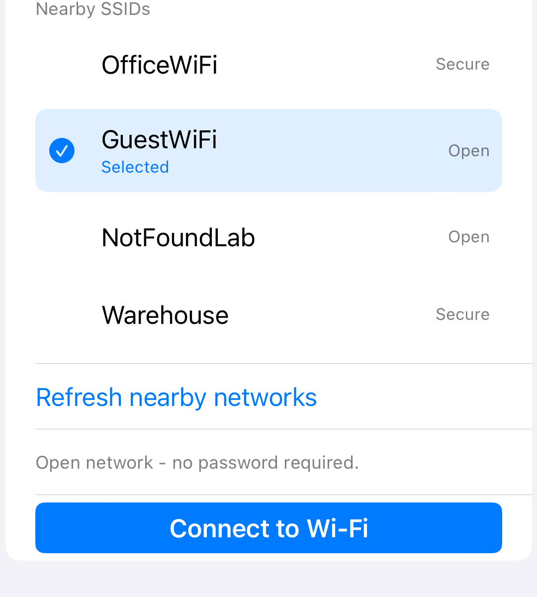 iPhone setup screen showing an open Wi-Fi network selected with no password required