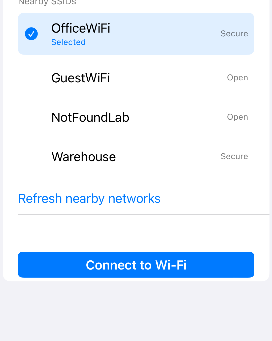 iPhone setup screen showing nearby Wi-Fi networks with a secure network selected